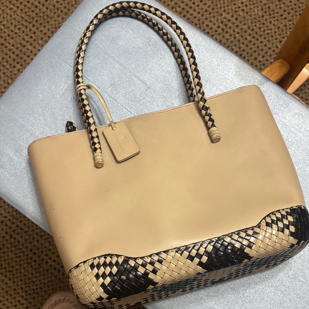 Elegant Etienne Aigner Beige and Black Leather Bag with crossbody strap.